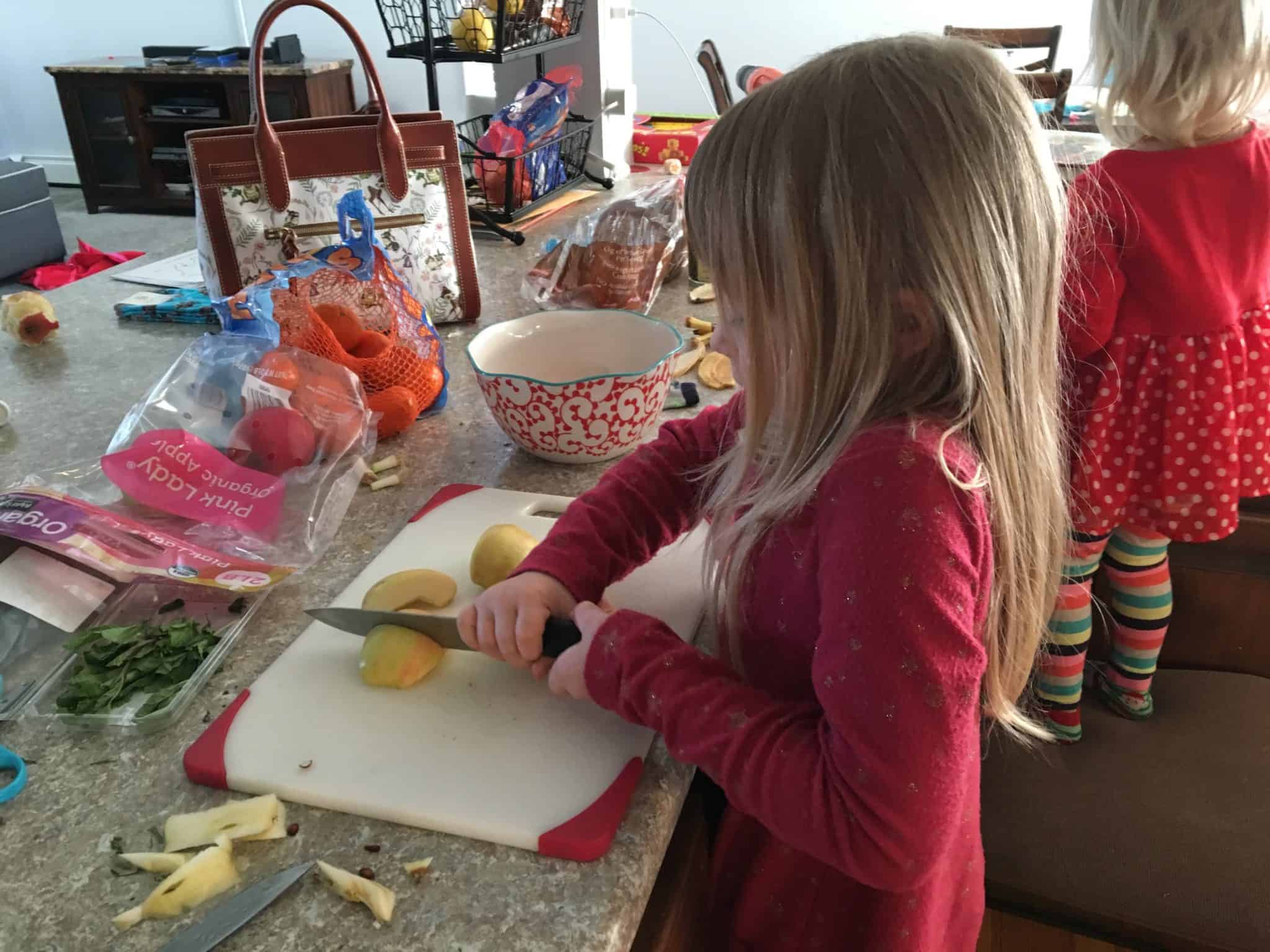 Kids using knife in kitchen