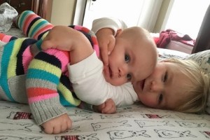 toddler and infant sisters