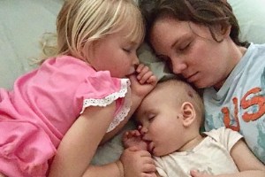 sleeping baby and toddler with mother