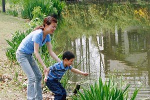 Mother and son at pond