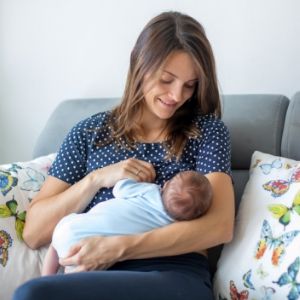 breastfeeding mother on couch