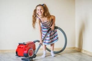 girl vacuuming