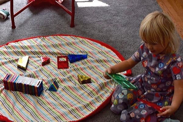Little-girl-at-DIY-playmat-and-bag