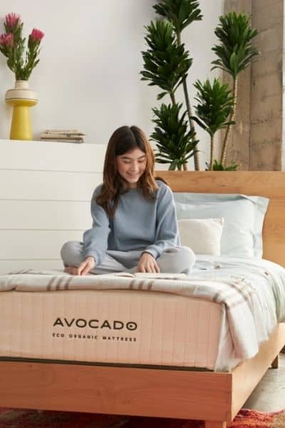 Avocado Eco Organic twin sized mattress with little girl on it
