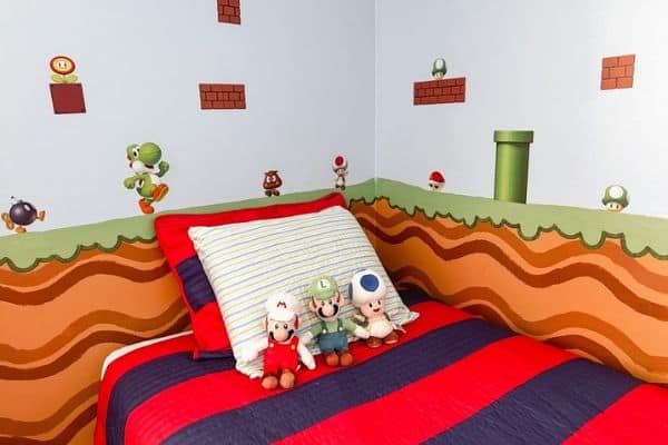 head of twin sized bed with Kiwi mattress and Mario decor