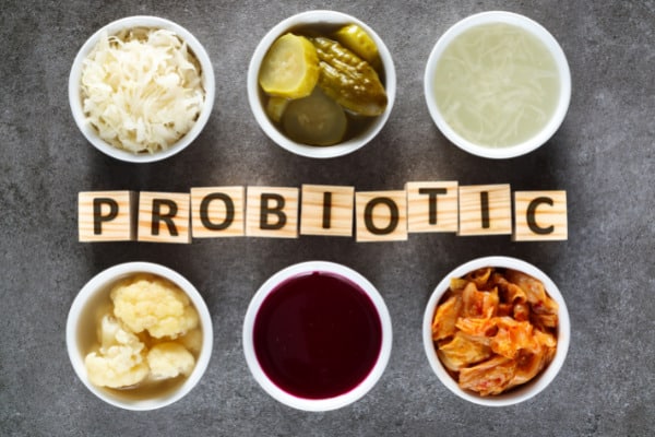 Picture showing six different cups of foods, all containing different probiotic options.