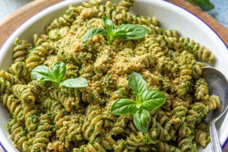 vegan kale pesto in white plate with a spoon